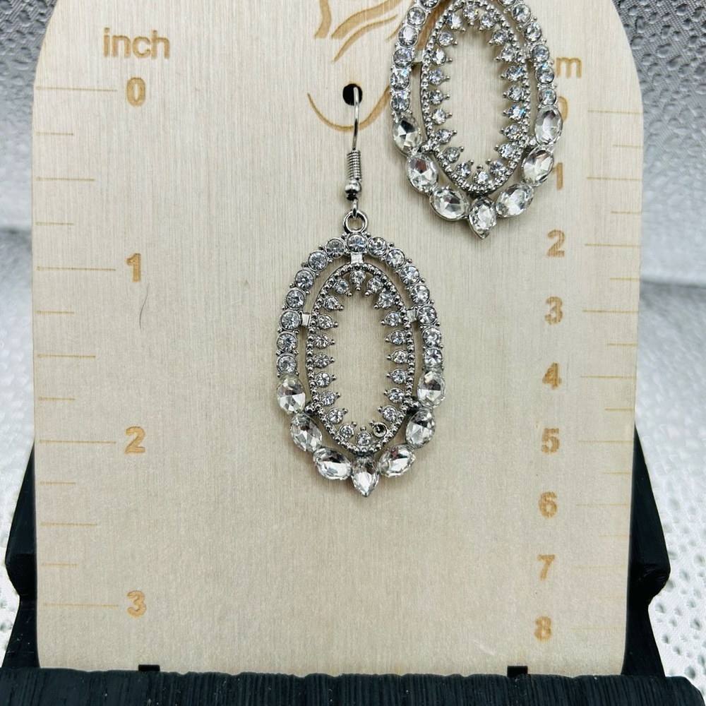 Sparkling Silver Oval Earrings with Intricate Design